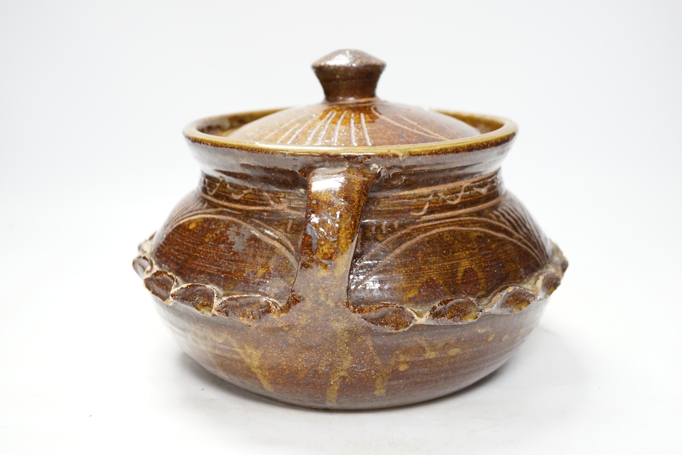 A Wenford Bridge stoneware jar and cover, Gwari, by Michael Cardew, 18cm. Condition - fair, some wear to glaze.